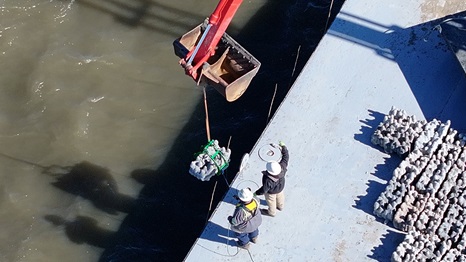 Chevron-sponsored installation of concrete structures to help restore marine habitats impacted by storms.