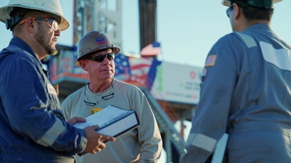 Three workers in hard hats