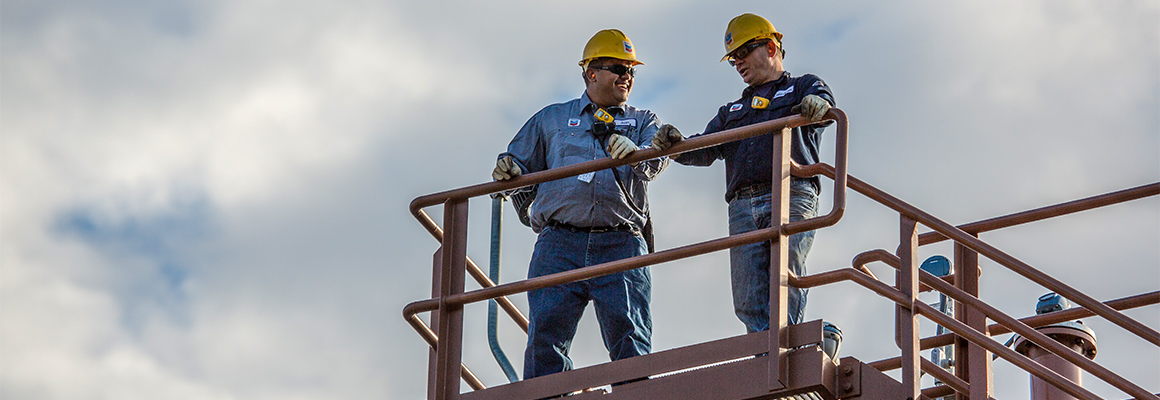 Two workers talking.